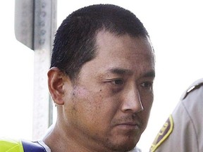 Vince Li is pictured at a court appearance in a Portage La Prairie, Man. August 5, 2008. The mother of a man beheaded by a fellow bus passenger in Manitoba says her son&#039;s killer is seeking an absolute discharge nine years after he was found not criminally responsible. THE CANADIAN PRESS/John Woods