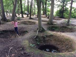 A child plays among the craters at the Sanctuary Wood Museum in Belgium.
