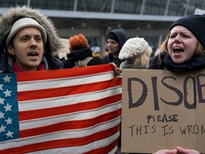 Protesters assemble at John F. Kennedy International Airport in New York, Saturday, Jan. 28, 2017 after two Iraqi refugees were detained while trying to enter the country. On Friday, Jan. 27, President Donald Trump signed an executive order suspending all immigration from countries with terrorism concerns for 90 days. Countries included in the ban are Iraq, Syria, Iran, Sudan, Libya, Somalia and Yemen, which are all Muslim-majority nations. (AP Photo/Craig Ruttle)