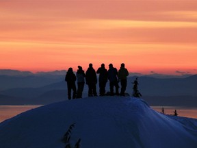 Back country visitors enjoy a sunset in Mount Seymour Provincial Park, where jammed parking lots and traffic jams on the access road have become a reality of the popularity of winter sports.