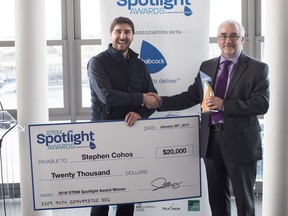 BCIT student Stephen Cohos took the grand prize of $20,000 at the inaugural STEM Awards. Mark Dixon, President of Babcock Canada, presents the award.