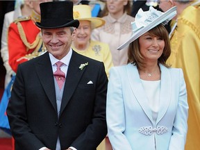 Carole Middleton, with her husband Michael, attending her daughter Catherine's wedding to Prince William in 2011, epitomizes an elegantly attired mother of the bride.