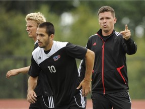 Alan Koch, right, will miss the city and mountains, but the former head coach of the Vancouver Whitecaps FC2 is excited about coaching, scouting and possibly getting FC Cincinnati into Major League Soccer one day soon.