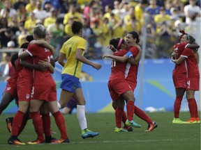 Canada players celebrate after beating Brazil 2-1 on the bronze medal match of the women's Olympic football tournament between Brazil and Canada.