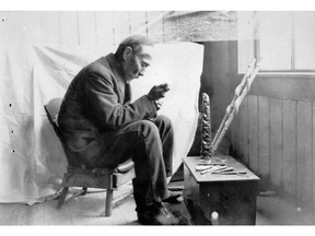 Charles Edenshaw at work, in Massett, Haida Gwaii. Image PN05168 courtesy of the Royal BC Museum and Archives.  [PNG Merlin Archive]