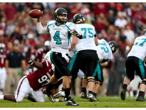 COLUMBIA, SC - NOVEMBER 23:  Alex Ross #4 of the Coastal Carolina Chanticleers drops back to pass during their game against the South Carolina Gamecocks at Williams-Brice Stadium on November 23, 2013 in Columbia, South Carolina.