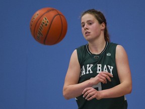 COQUITLAM. January 16 2015. Oak Bay Breakers #9 Sophie de Goede passes the ball  during a game against the W.J. Mouat Hawks at the 2015 Top Ten Shoot-Out girls high school basketball tournament at Centennial Secondary, Coquitlam, January 16 2015. Gerry Kahrmann  /  PNG staff photo)  ( For Prov Sports )  Story by Howard Tsumura 00034184A