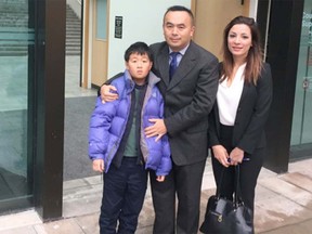 Lyndon Chen, his 10-year-old son, Dare Chen, and lawyer Leena Yousefi outside the Vancouver Law Courts on Tuesday. Chen claims his estranged wife abducted his daughter five years ago in Taiwan and is living in Canada. He's asking a B.C. Supreme Court judge to issue an order allowing him to get his daughter back.