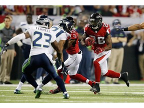 Tevin Coleman of the Falcons runs the ball against the Seahawks.