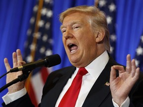 President-elect Donald Trump speaks during a news conference in the lobby of Trump Tower in New York.