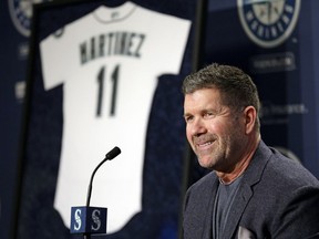 Seattle Mariners former designated hitter Edgar Martinez smiles as he speaks at a news conference announcing the retirement by the team of his jersey number 11, Tuesday, Jan. 24, 2017, in Seattle. The Mariners will retire Martinez's number as he continues to move closer to induction in the baseball Hall of Fame. Team president Kevin Mather said that Martinez's number will be officially retired Aug. 12 as part of a weekend celebration.