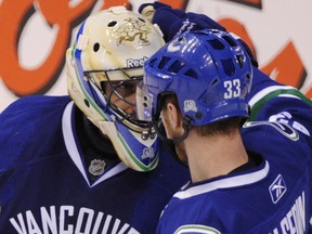 Henrik Sedin (right) and Roberto Luongo as teammates during the 2011 playoffs.
