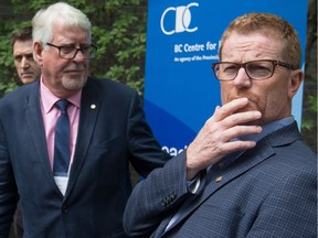B.C. Health Minister Terry Lake, right, said he and Provincial Health Officer Dr. Perry Kendall, left, have talked several times about the idea of prescribing heroin.