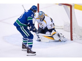 Nashville Predators' goalie Pekka Rinne, of Finland, stops Vancouver Canucks' Loui Eriksson, of Sweden, during the second period of an NHL hockey game in Vancouver, B.C., on Tuesday January 17, 2017.