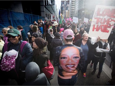 A man wears a t-shirt bearing an image of Oprah Winfrey during a women's march and protest against U.S. President Donald Trump, in Vancouver, B.C., on Saturday January 21, 2017.