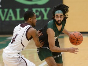 Fraser Valley point guard Manny Dulay (right) is leading the nation in made three-pointers for the Cascades.