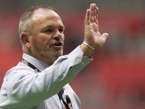 Canada head coach Mark Anscombe gives instructions to his players as they warm up before a rugby test match against Japan in Vancouver, B.C., on Saturday June 11, 2016.