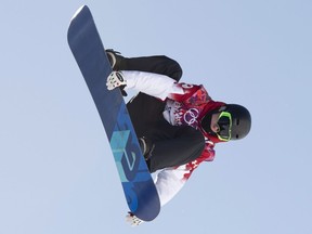 Canada's Maxence Parrot flies through the air during a qualification run at the Sochi Winter Olympics in Krasnaya Polyna, Russia, Thursday, Feb. 6, 2014.