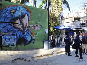 Police guard the entrance of the Blue Parrot nightclub in Playa del Carmen, Mexico, Monday, Jan. 16, 2017. A deadly shooting occurred in the early morning hours outside the nightclub while it was hosting part of the BPM electronic music festival, according to police.