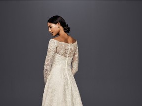 Off-The-Shoulder Lace A-Line Wedding Dress by Oleg Cassini, $1,358 at David's Bridal.