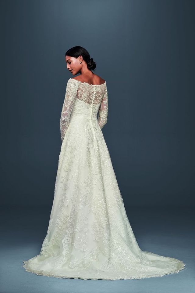 Off-The-Shoulder Lace A-Line Wedding Dress by Oleg Cassini, $1,358 at David's Bridal. 