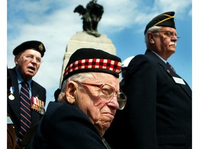 Ernest (Smokey) Smith, then-Canada's last surviving Victoria Cross winner, (middle foreground) watched over the 60th anniversary of the end of the Battle of the Atlantic at the War Memorial in Ottawa in 2005.