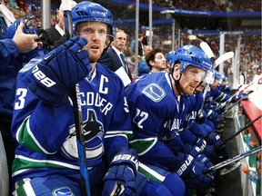 Henrik Sedin (left) is just two points shy of 1,000 for his NHL career. He could hit the mark Tuesday against the Nashville Predators.