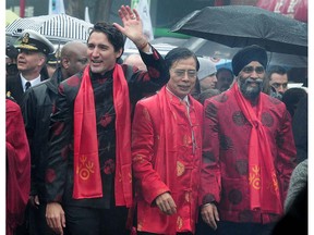 Prime Minister Justin Trudeau attends the 44th annual Chinese New Year Parade in Vancouver, BC., January 29, 2017. Defence Minister Harjit Sajjan (right).
