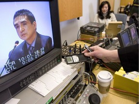 RCMP Cpl. Benjamin Monty Robinson is seen on a television screen as he testifies at the Braidwood inquiry in Vancouver on March 23, 2009.