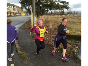 Sandra Jongs Sayer, right, works out with Sun Run InTraining leader Danette Haar in last year's Run10KStronger program at W.C. Blair Rec Centre in Langley. Sayer has graduated to clinic coordinator this year and hopes to inject some fun as she whips her classmates into 10K shape over the winter.