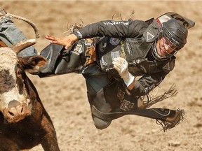 Ty Pozzobon rides a bull called Wrangler Extreme during the Calgary Stampede in 2014.