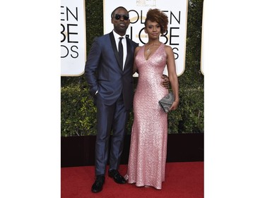Sterling K. Brown, left, and Ryan Michelle Bathe arrive at the 74th annual Golden Globe Awards .