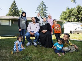 The Sua'ifan family in front of their home in Surrey, B.C.