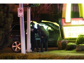 A victim was located in a vehicle that crashed into the sign at a Surrey McDonald's restaurant, suffering from gunshot wounds. He died at the scene.