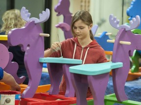 Students put the finishing touches on wooden ride 'em toys at the wood shop at Fraser Heights Secondary school in Surrey, BC Wednesday, December 8, 2016.