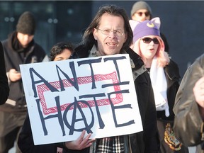 Protesters attend a march and rally against bigotry in Surrey on Sunday on the eve of Martin Luther King Day.