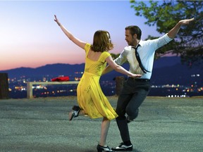 This image released by Lionsgate shows Ryan Gosling, right, and Emma Stone in a scene from, "La La Land."