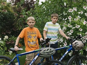 This is a photo of Nelson and Elliot Roy (Elliot on the left), who had filed a human rights complaint after boys were excluded from getting the human papillomavirus (HPV) vaccination for free under the province's publicly-funded immunization program. The government announced Friday that boys will be able to get the vaccination for free in September, and the two boys are very happy with the government announcement.