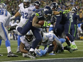 Seattle Seahawks running back Thomas Rawls (34) rushes for a touchdown against the Detroit Lions in the second half of an NFL football NFC wild card playoff game, Saturday,
