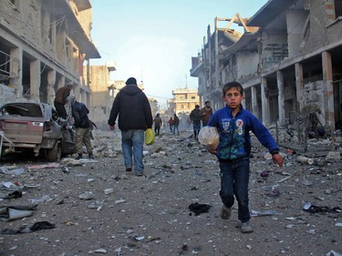 The emptying of Syria is the biggest forced migration of humanity since the Second World War. Millions of individually shattered lives will reshape the Middle East — and the world beyond — for generations to come A Syrian boy runs while carrying bread following a reported airstrike by government forces, in the Syrian town of Binnish, on the outskirts of Idlib, on January 12, 2017. At least 22 jihadists were killed in air strikes on Idlib province over the past 24 hours, the Syrian Observatory for Human Rights said.