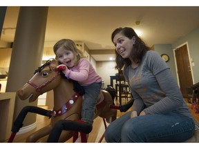 Heather Allen, with two-year-old daughter Brodie. Allen, who would like to work full time but can't find affordable or readily available daycare, is a part-timer for a startup company.