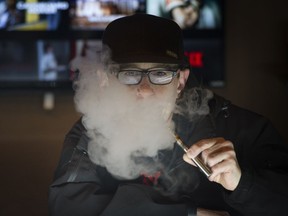 T-shirt designer Dan "Maniac" Cummer enjoys his vaporizer since he quit smoking.