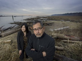 Howard Grant on the banks of the Fraser River at the Musqueam reserve in Vancouver along with film producer Sarah Ling.