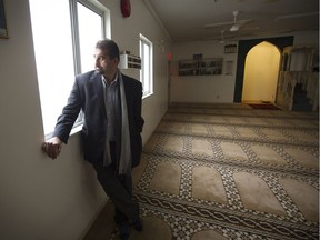 Haroon Khan reflects on a troubled weekend looks out from inside the Al Jamia mosque in Vancouver on Monday. ‘I would say 99 per cent of Canadians are not hostile to Muslims,’ he said.