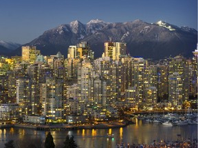 Evening glow settles over downtown Vancouver. Latest figures show foreign buyers getting back into real estate market.