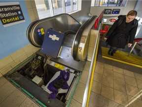 Work is being done on an escalator at the Granville SkyTrain Station in Vancouver on Tuesday.