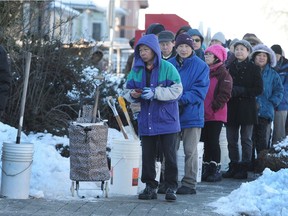 Vancouver residents line up outside Fire Hall #14 on Venables Street for free city-supplied salt which never arrived, in Vancouver, Wednesday, January 4, 2017.
