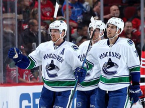 The Vancouver Canucks first-line power-play unit of Daniel Sedin, left, with brother Henrik and Brandon Sutter, right, isn't getting the job done.