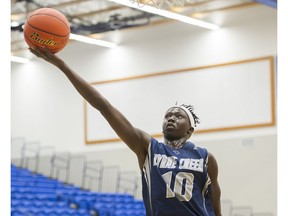 Byrne Creek Bulldogs Bithow Wan reaches for the ball during play against the Holy Cross Crusaders in a basketball game at the 2016 Tsumura Basketball Invitational at the LEC, Langley, December 10 2016.