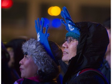 New Year's Eve revellers watch Crystal Shawanda on one of the two outdoor stages at Concord's New Year's Eve Vancouver Celebration, held at Canada Place on Dec. 31, 2016.